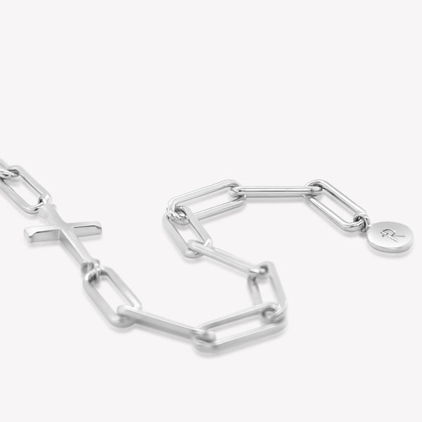 Rizen Jewelry Chain Breaker bracelet in sterling silver.  Elegant Cross Pendant breaks up the contemporary paper clip link chain with circular Rizen tag on last link of chain.